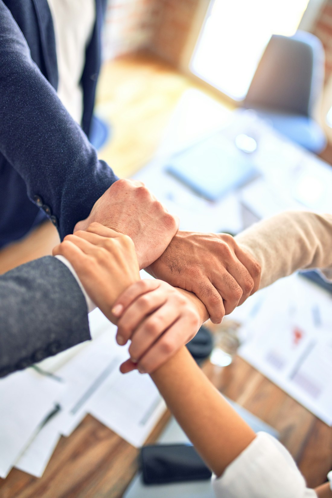Happy client shaking hands with our team